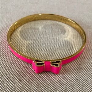 Kate Spade pink enamel and gold Take a Bow Bangle